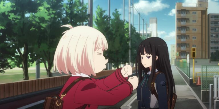 Chisato mimes driving a car while Takina looks on unimpressed in Lycoris Recoil.